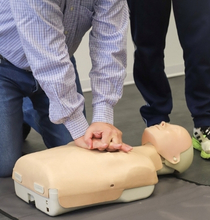 Adult CPR training demonstration